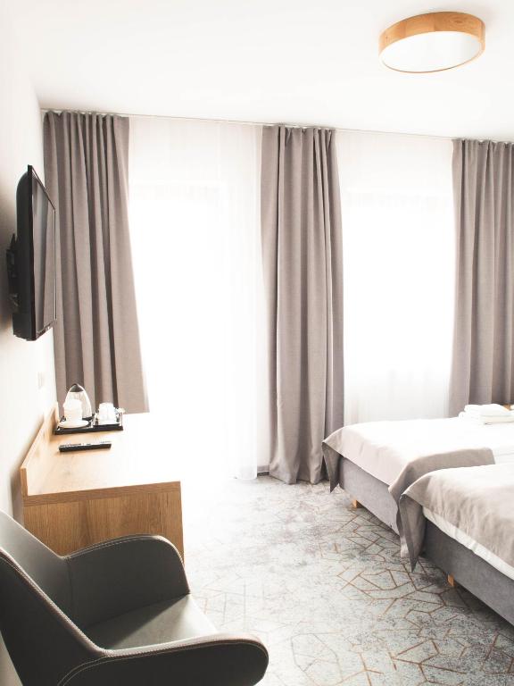 Postel nebo postele na pokoji v ubytování Hotel Beskidian