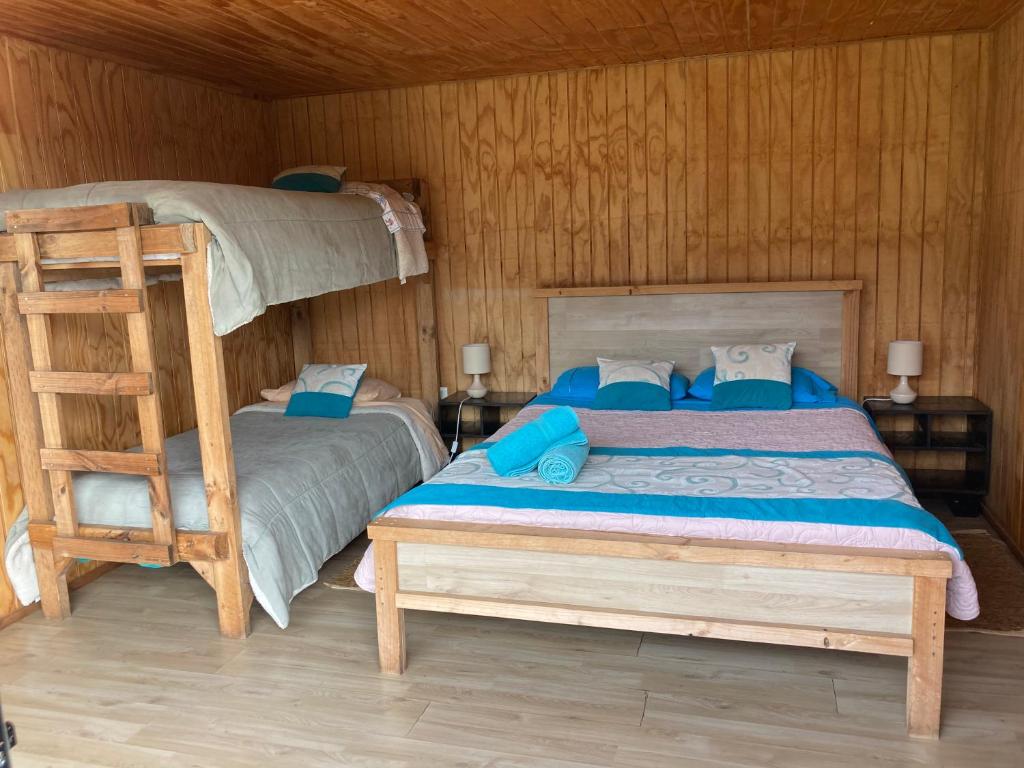 Uma cama ou camas num quarto em Surf and Stay Chile