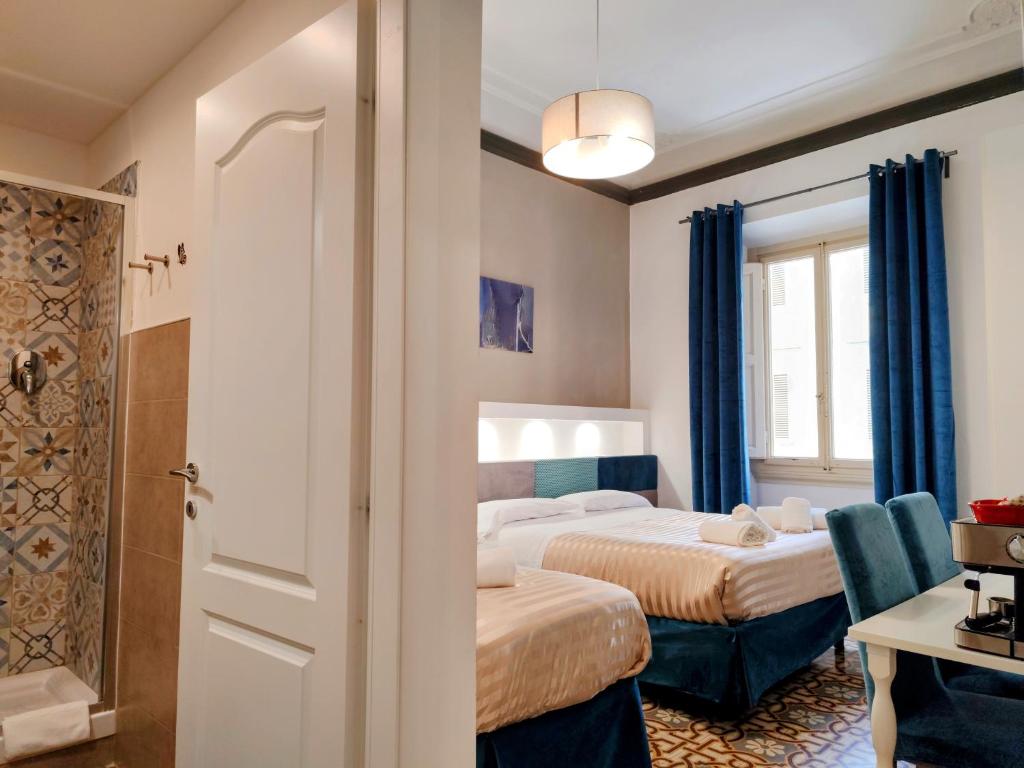 Posteľ alebo postele v izbe v ubytovaní Residenza San Lorenzo Firenze