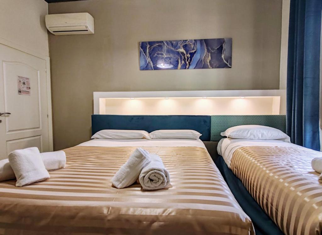 Posteľ alebo postele v izbe v ubytovaní Residenza San Lorenzo Firenze