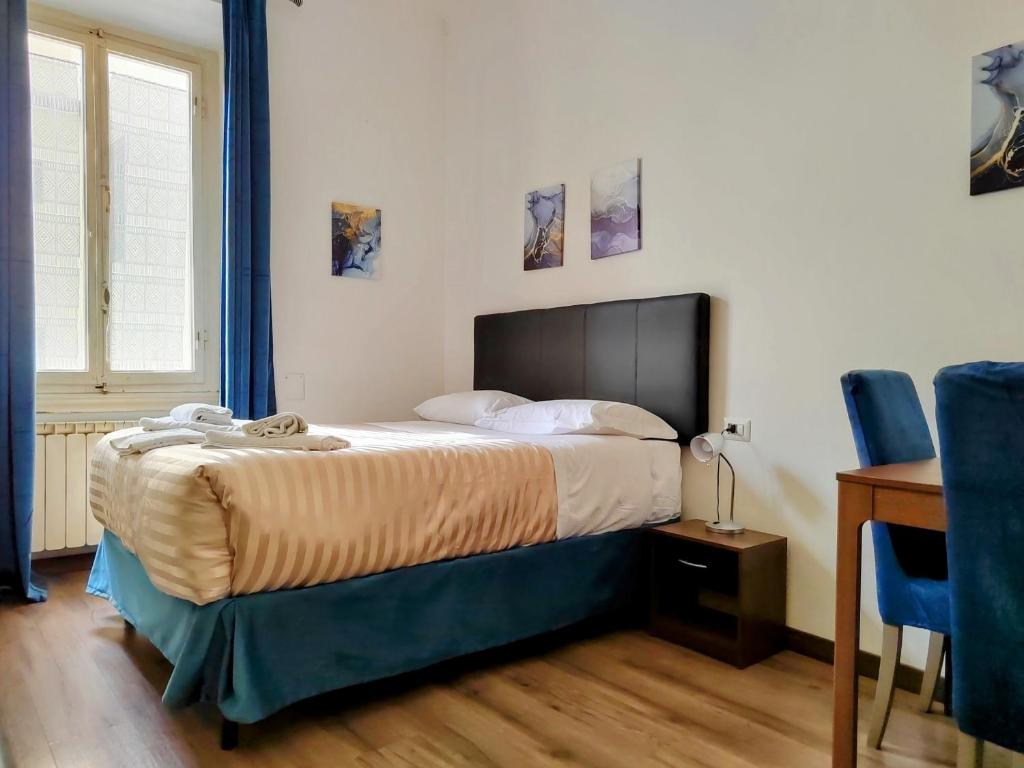 Posteľ alebo postele v izbe v ubytovaní Residenza San Lorenzo Firenze