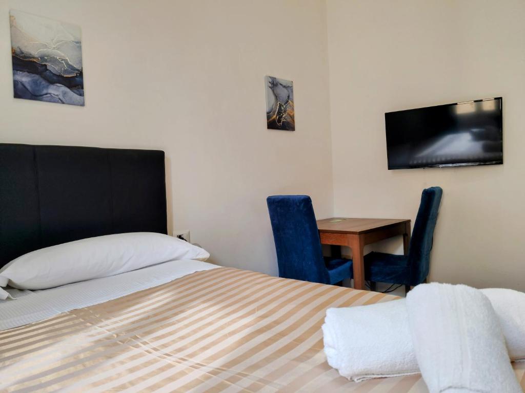 Posteľ alebo postele v izbe v ubytovaní Residenza San Lorenzo Firenze