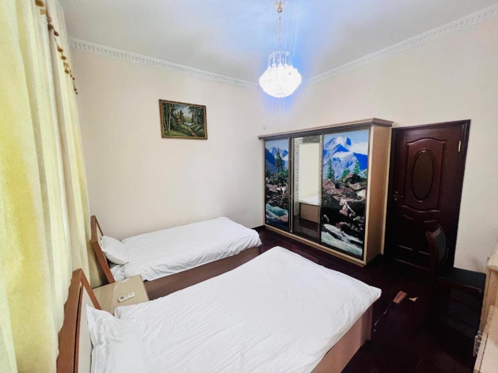 Cama o camas de una habitación en Гостиница Алишер