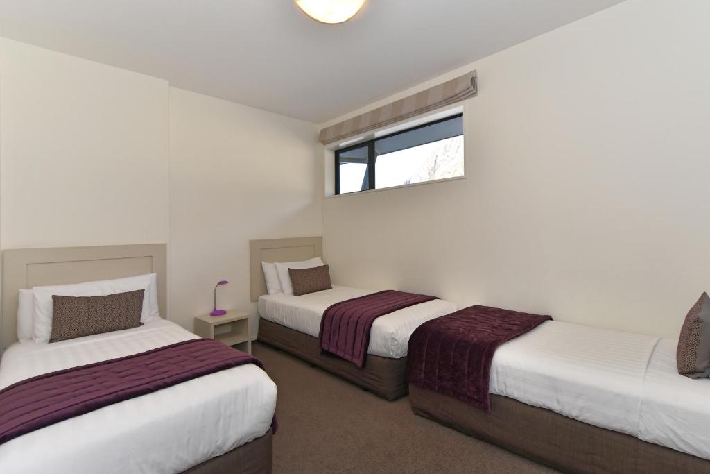 Postel nebo postele na pokoji v ubytování Aoraki Court Motel