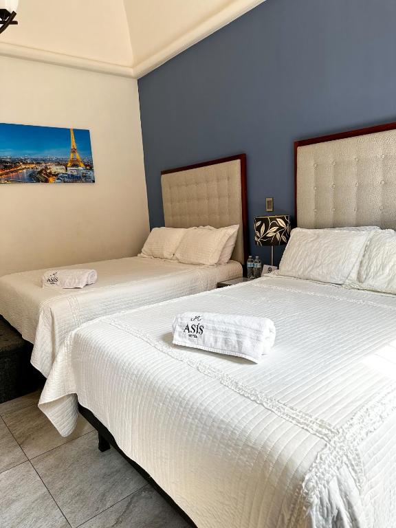 Postel nebo postele na pokoji v ubytování Hotel Asís