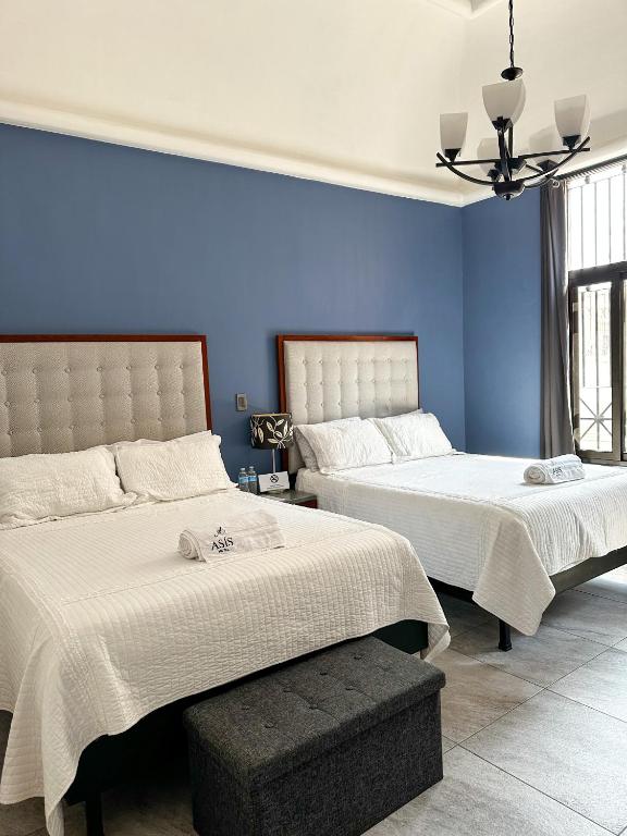 Postel nebo postele na pokoji v ubytování Hotel Asís