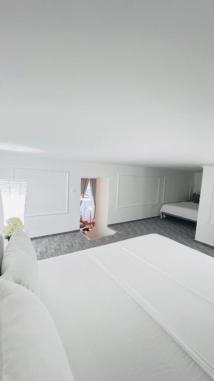 Postel nebo postele na pokoji v ubytování Jozsef 65 Apartment