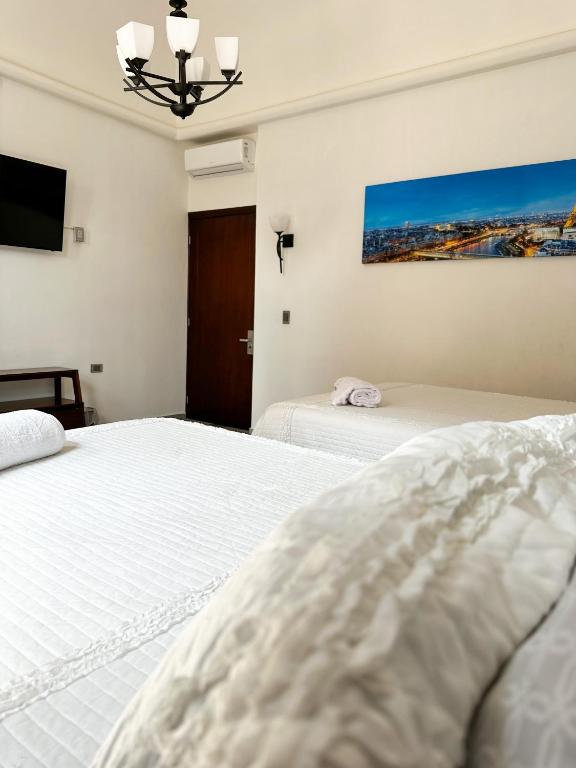 Postel nebo postele na pokoji v ubytování Hotel Asís