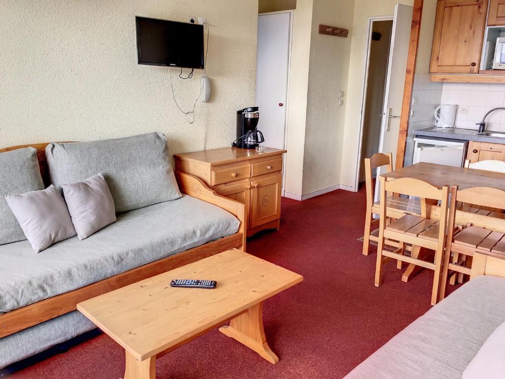 a living room with a couch and a table at Appartement Les Arcs 1800, 3 pièces, 6 personnes - FR-1-346-571 in Bourg-Saint-Maurice