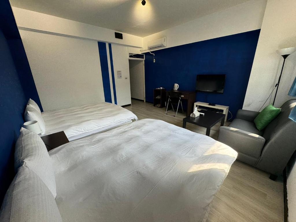 Postel nebo postele na pokoji v ubytování Still Haus 静の宿