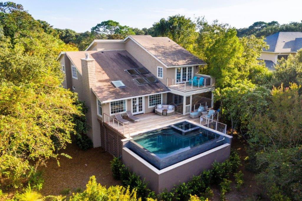 an aerial view of a house with a swimming pool at 81 Surfsong Rd in Kiawah Island