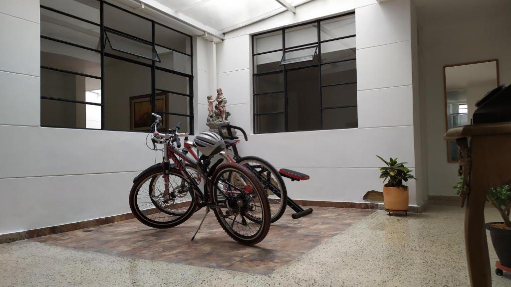 two bikes are parked next to a wall at Casa en Laureles, ideal para familias in Medellín