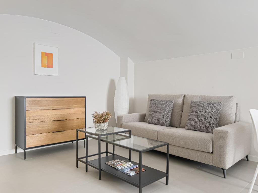 a living room with a couch and a table at Majordoms - Ca les Cosines 48 in Banyoles