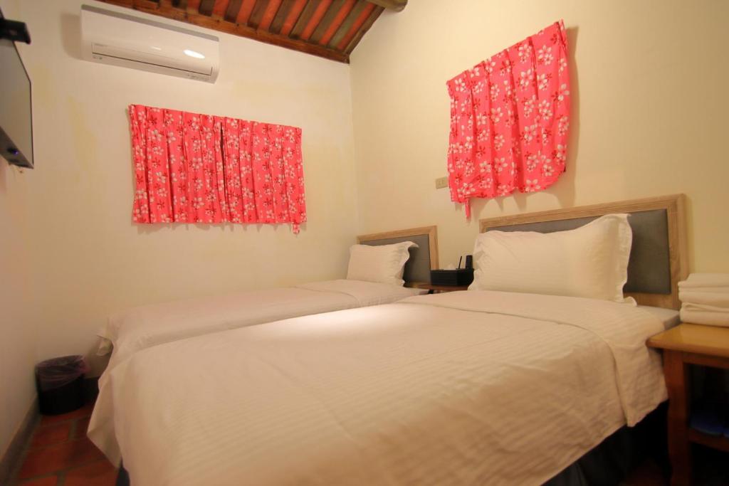 Postel nebo postele na pokoji v ubytování Yong Le Homestay