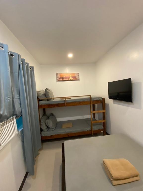 Postel nebo postele na pokoji v ubytování Ati Lodge Boracay
