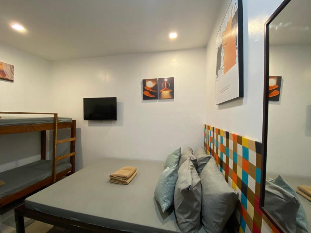 Postel nebo postele na pokoji v ubytování Ati Lodge Boracay