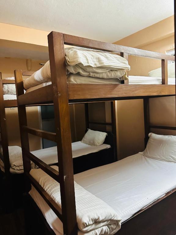 Postel nebo postele na pokoji v ubytování Hotel Travelers Home