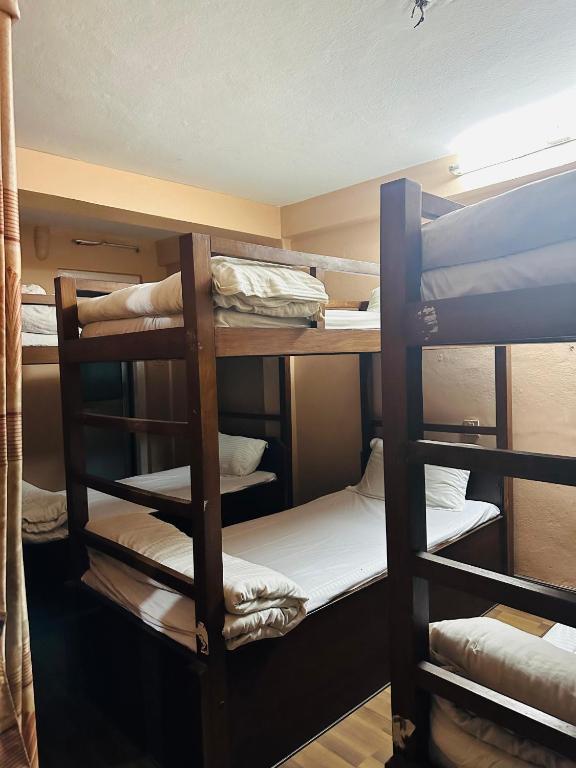 Postel nebo postele na pokoji v ubytování Hotel Travelers Home
