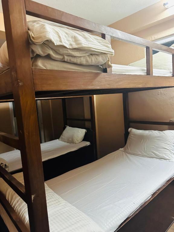 Postel nebo postele na pokoji v ubytování Hotel Travelers Home