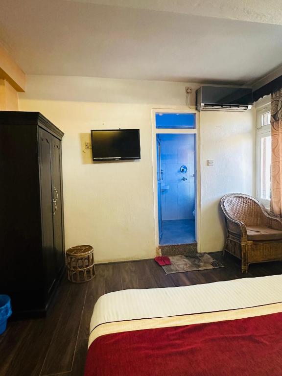 Postel nebo postele na pokoji v ubytování Hotel Travelers Home