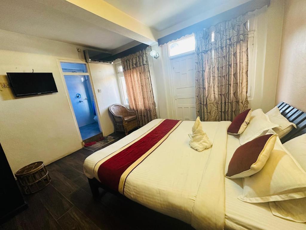 Postel nebo postele na pokoji v ubytování Hotel Travelers Home