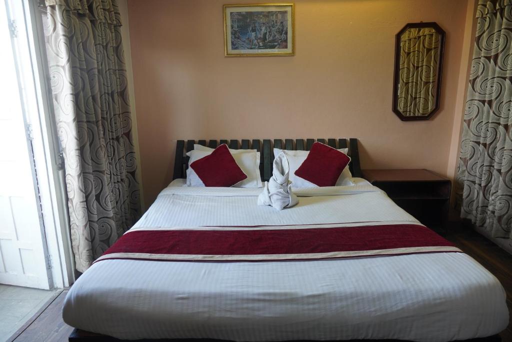 Postel nebo postele na pokoji v ubytování Hotel Travelers Home