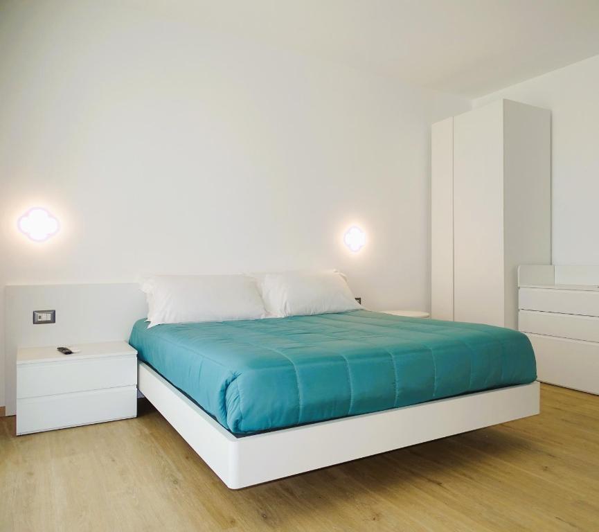 Postel nebo postele na pokoji v ubytování Residence Cala Bianca