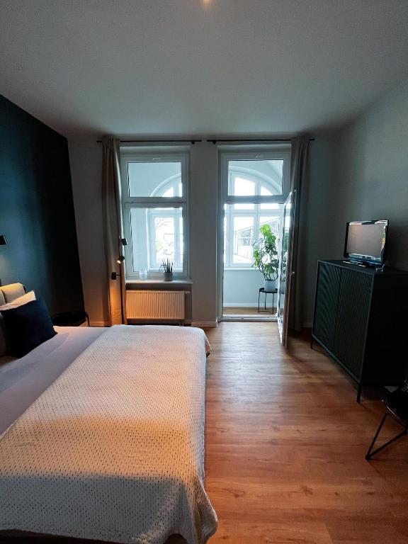 Postel nebo postele na pokoji v ubytování Studios am Hafen