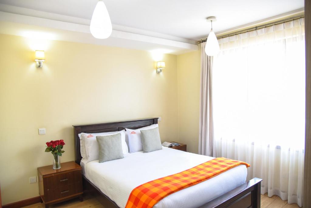 Postel nebo postele na pokoji v ubytování Fedha Residences by Trianum