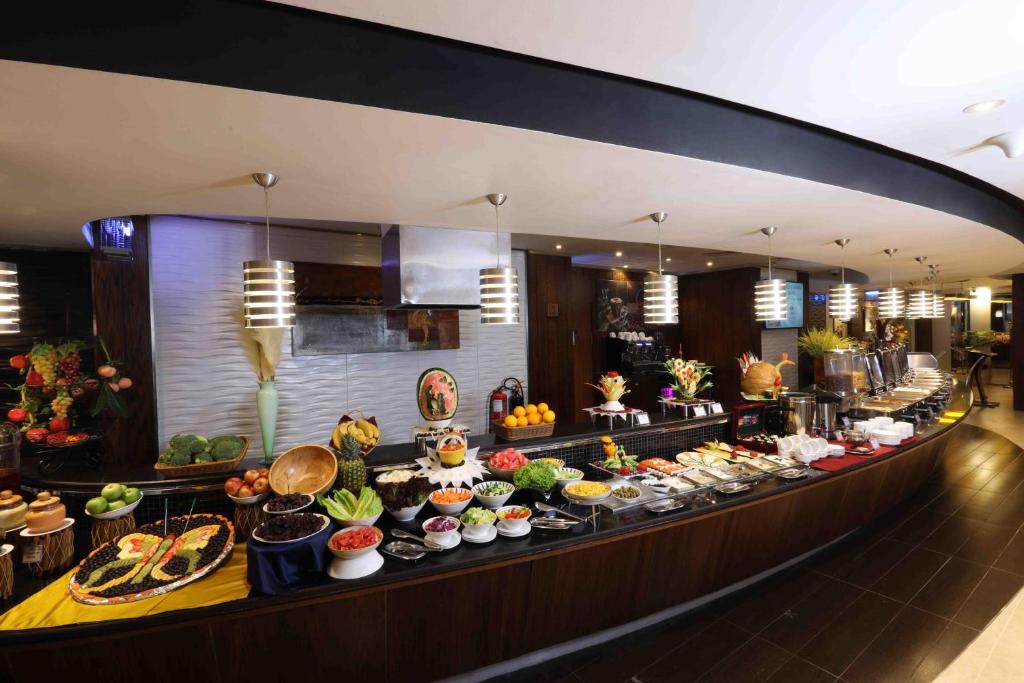 a buffet line with many different types of food at City Tower Hotel in Fujairah
