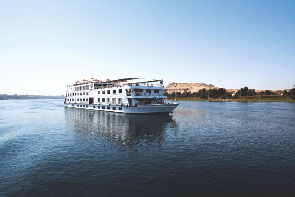 a large white boat in the middle of the water at Jaz Imperial Nile Imperial Cruise - Every Thursday from Luxor- Aswan- Luxor for 07 Nights in Luxor