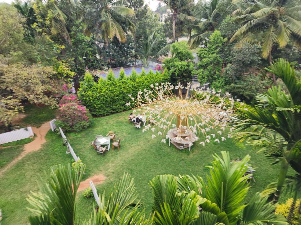 an aerial view of a garden with a fountain at Seed Resort in Shrīrangapattana