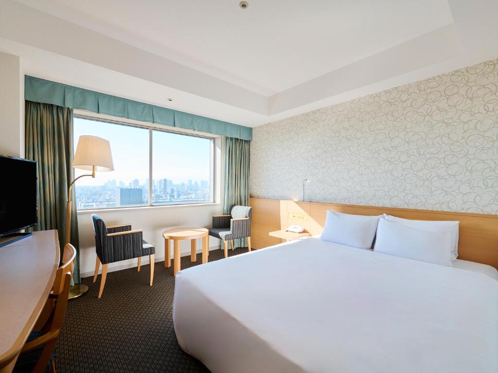 Postel nebo postele na pokoji v ubytování Tobu Hotel Levant Tokyo