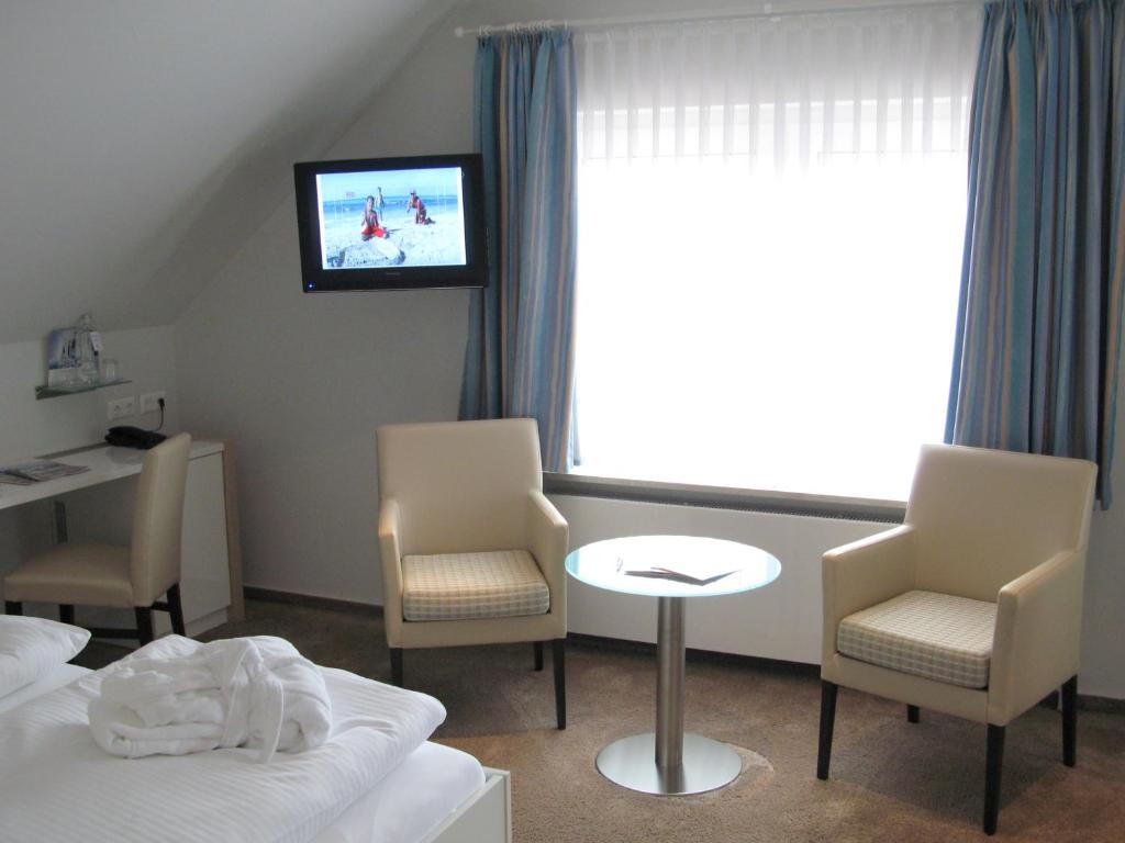 TV a/nebo společenská místnost v ubytování Frühstückshotel Seemannsbraut Amrum-adults only ab 18 Jahre-keine Haustiere-