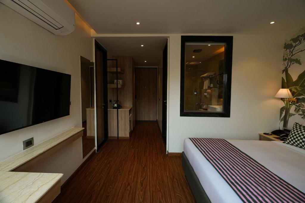 Postel nebo postele na pokoji v ubytování The LIV Hotel Jaipur A City Center Boutique Hotel & Experiential Hub