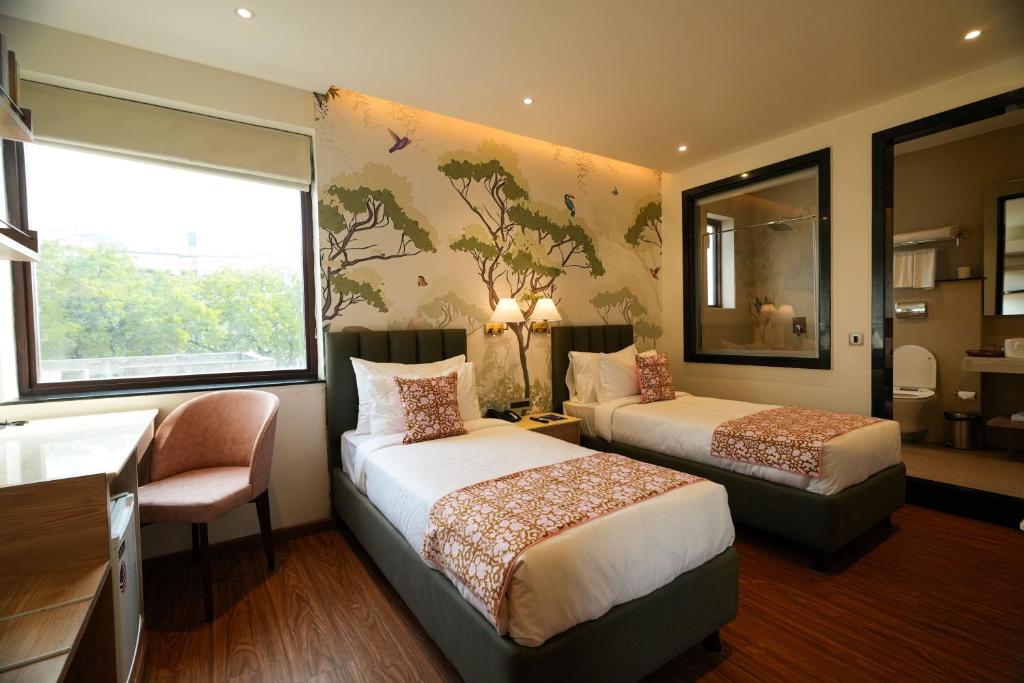 Postel nebo postele na pokoji v ubytování The LIV Hotel Jaipur A City Center Boutique Hotel & Experiential Hub