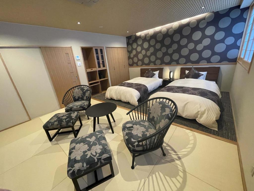 Postel nebo postele na pokoji v ubytování Hotel Kazurabashi