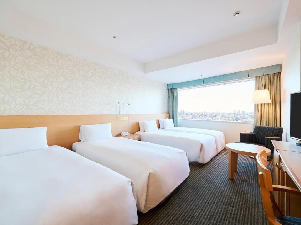 Postel nebo postele na pokoji v ubytování Tobu Hotel Levant Tokyo