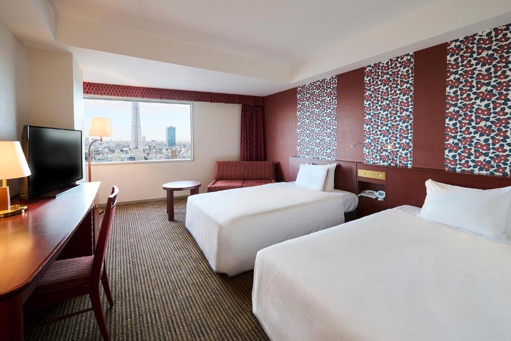 Postel nebo postele na pokoji v ubytování Tobu Hotel Levant Tokyo