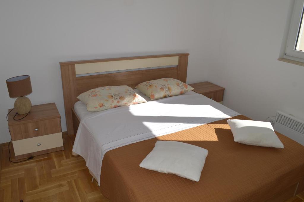 Posteľ alebo postele v izbe v ubytovaní Apartment Quattro