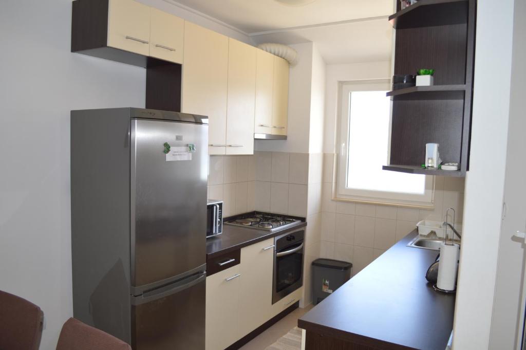 Kuchyňa alebo kuchynka v ubytovaní Apartment Quattro