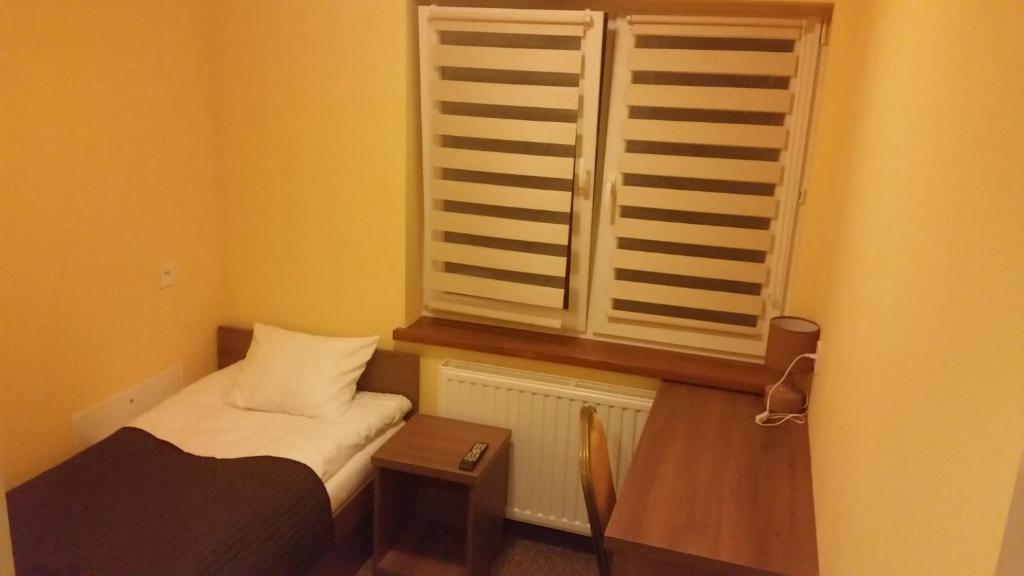 Postel nebo postele na pokoji v ubytování HOTELik A2