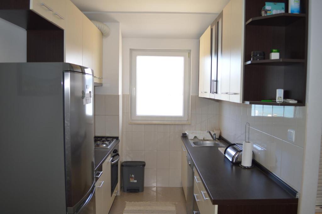 Kuchyňa alebo kuchynka v ubytovaní Apartment Quattro
