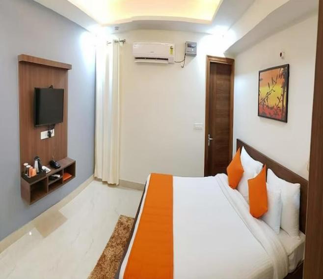 Postel nebo postele na pokoji v ubytování Hotel Galaxy Inn