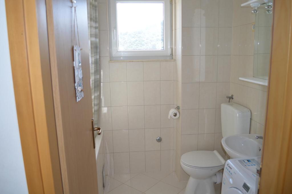 Kúpeľňa v ubytovaní Apartment Quattro