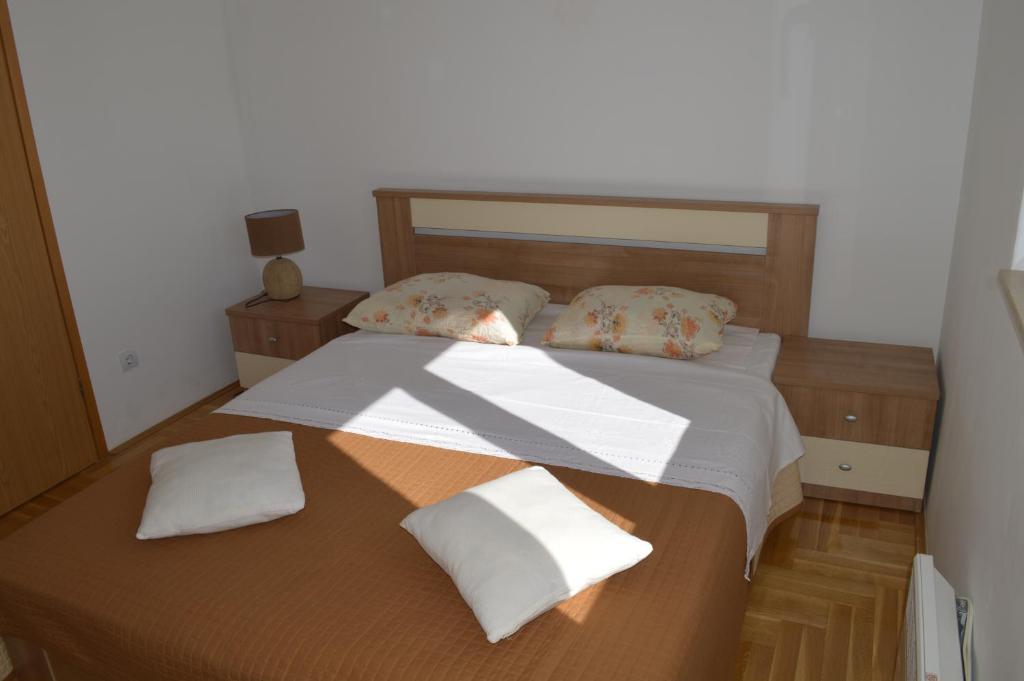 Posteľ alebo postele v izbe v ubytovaní Apartment Quattro