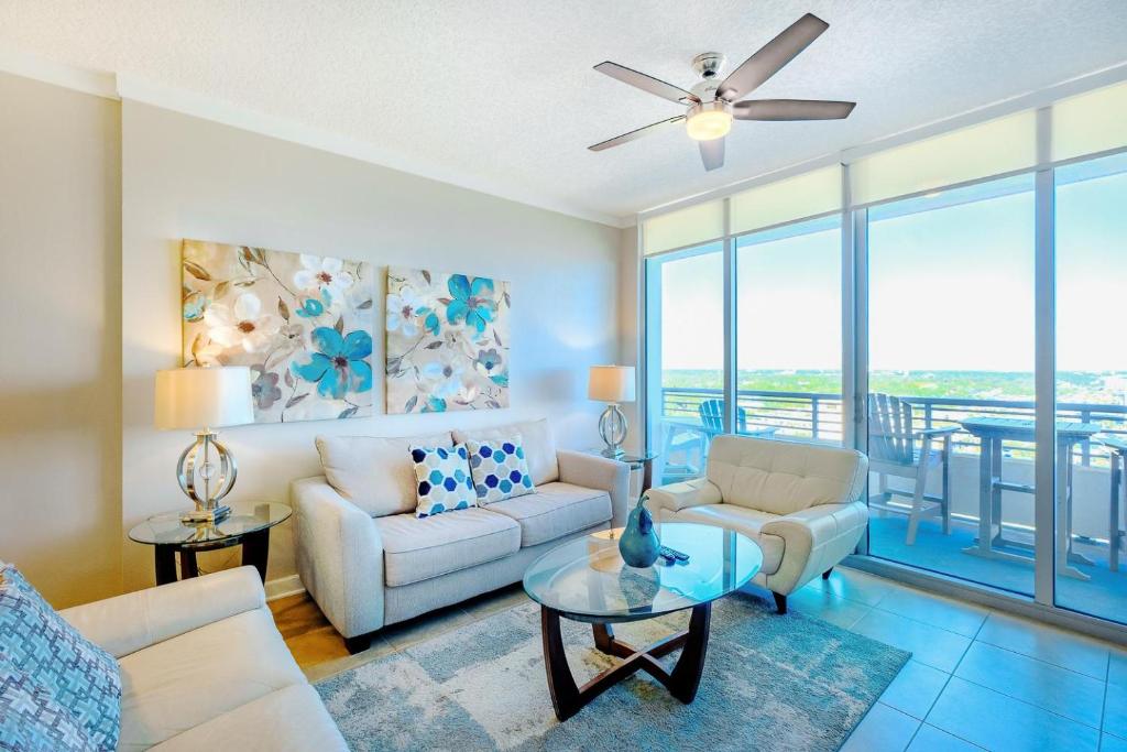 a living room with a couch and a table at Ocean Club 1607 in Biloxi