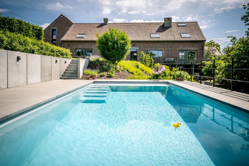 Bazén v ubytování B&B De Woestijn nebo v jeho okolí