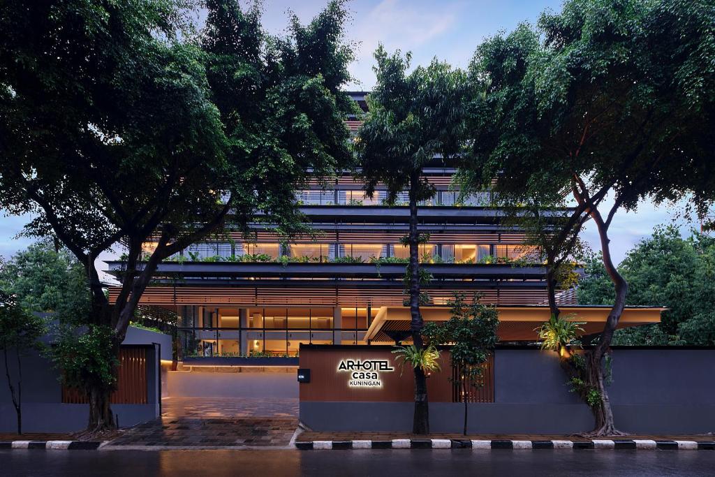 a building with a sign in front of it at ARTOTEL Casa Kuningan in Jakarta