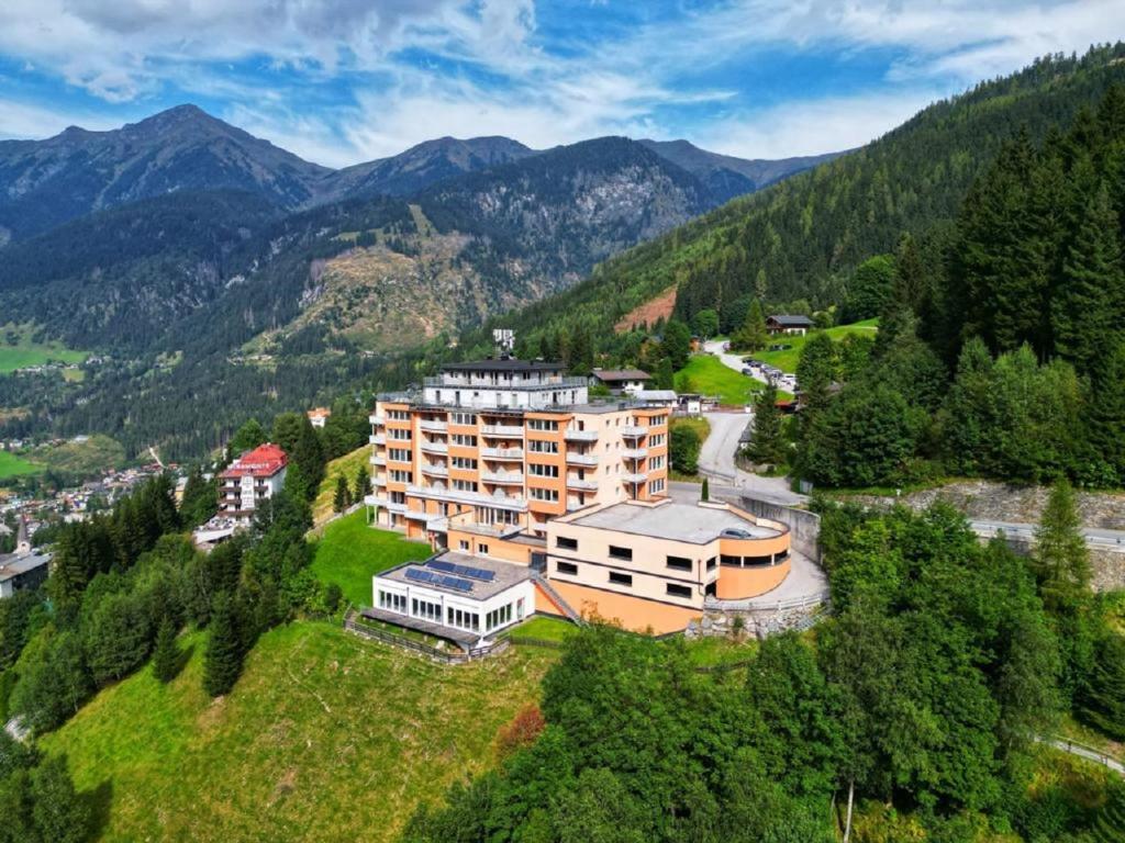 an aerial view of a building in the mountains at Panorama Spa Lodges DAS.SCHILLER in Bad Gastein